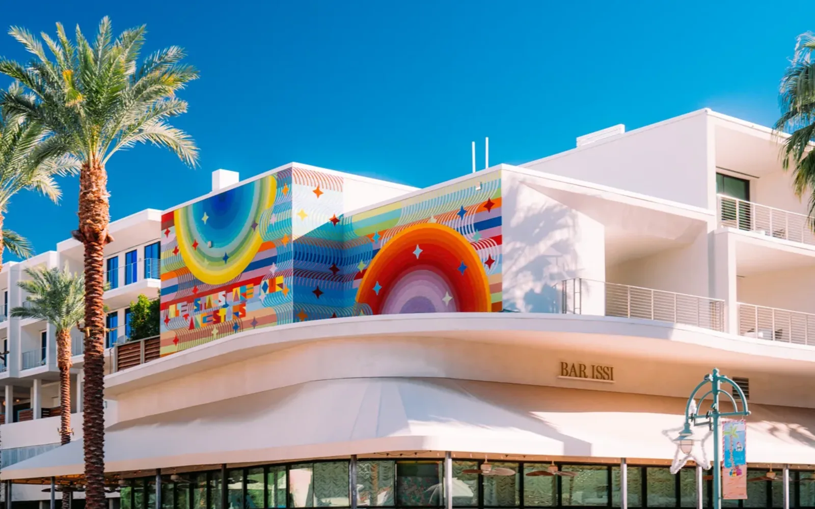 Palm Springs building facade and palms; regional Coachella Valley context for La Quinta.